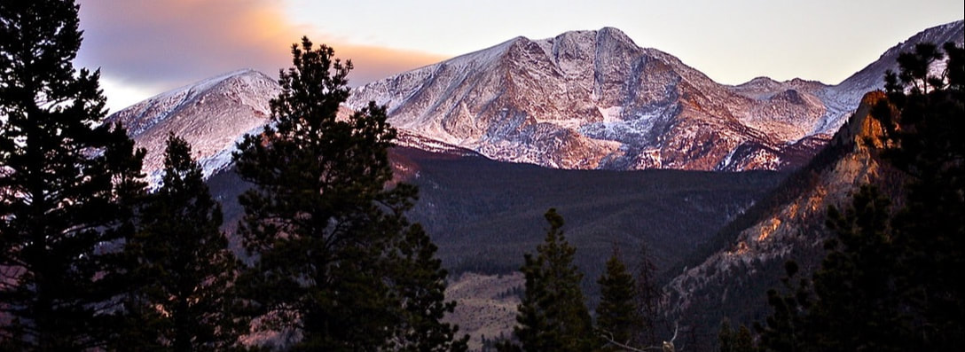 Image of Rock Mountain National Park panoram with a dusting of snow on the high peaks
